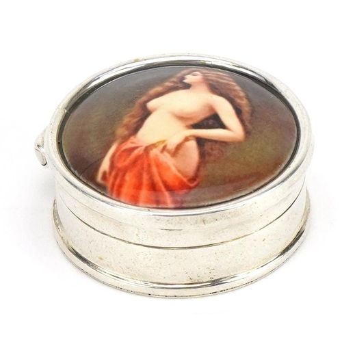 2747 - Circular silver and enamelled pillbox with hinged lid decorated with a semi nude female, 2.7cm in di... 