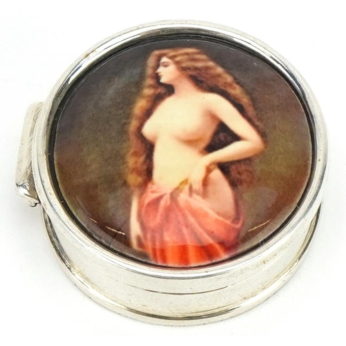 2747 - Circular silver and enamelled pillbox with hinged lid decorated with a semi nude female, 2.7cm in di... 