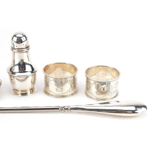 2756 - Edwardian and later silver objects including two napkin rings with engraved floral decoration, peppe... 