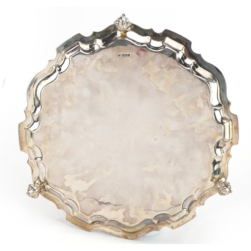 2714 - Martin Hall & Co Ltd, George V circular silver salver raised on three scrolled feet, Sheffield 1922,... 