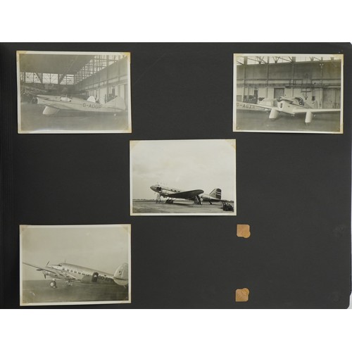 567 - Military interest black and white photographs arranged in an album including Bristol Freighter, RAF ... 