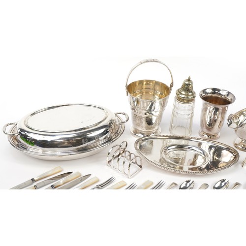 1241 - Silverplate including an oval entree dish with cover, ice bucket with swing handle, sauceboat and cu... 