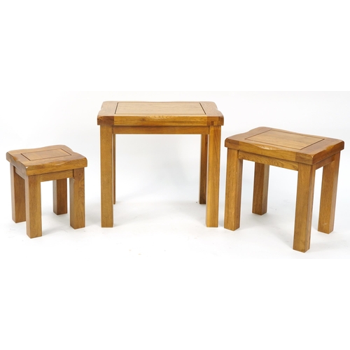 1010 - Nest of three light oak occasional tables, the largest 49cm H x 52cm W x 36cm D