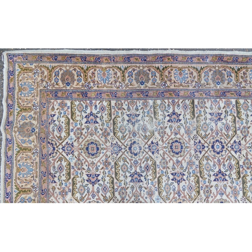 1016 - Rectangular Persian rug having an allover floral design within corresponding borders, 345cm x 255cm