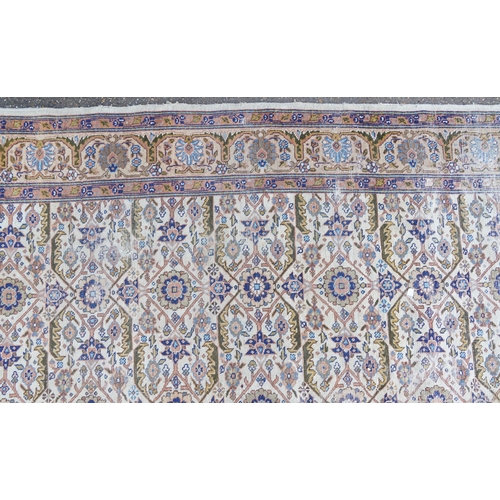 1016 - Rectangular Persian rug having an allover floral design within corresponding borders, 345cm x 255cm