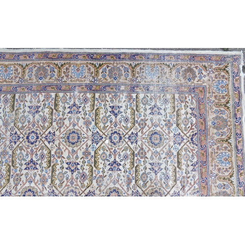 1016 - Rectangular Persian rug having an allover floral design within corresponding borders, 345cm x 255cm