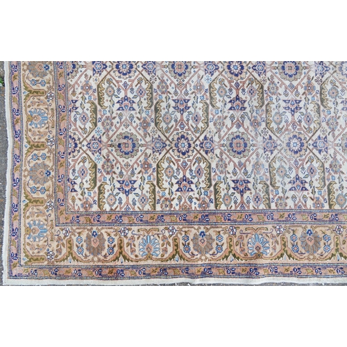 1016 - Rectangular Persian rug having an allover floral design within corresponding borders, 345cm x 255cm