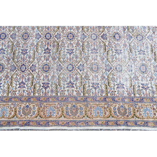 1016 - Rectangular Persian rug having an allover floral design within corresponding borders, 345cm x 255cm