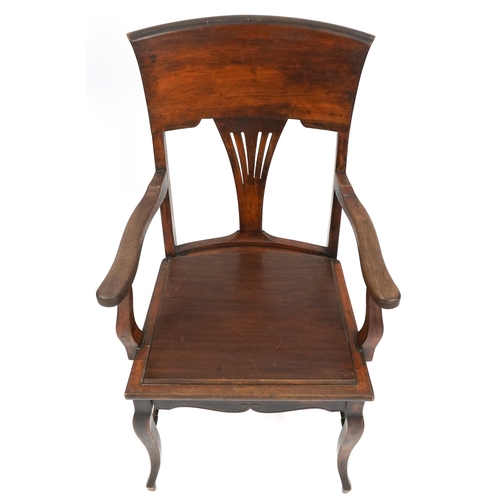 1024 - Jas Shoolbred and Co, mahogany armchair with H stretcher, 100cm high