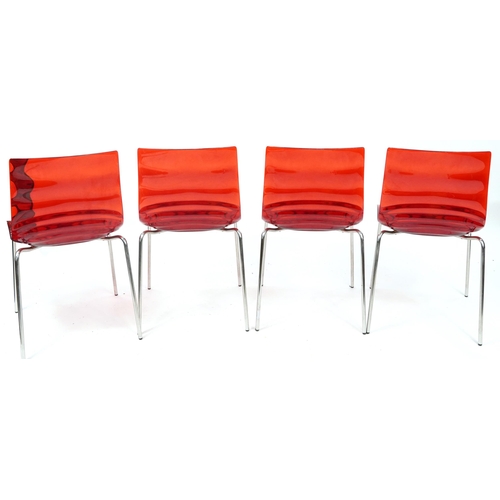 1026 - Calligaris, Italian circular chrome and glass dining table with four red Lucite chairs, the table 75... 