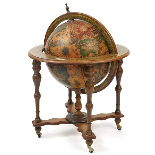 1028 - Large floor standing rotating wooden globe, 94cm high