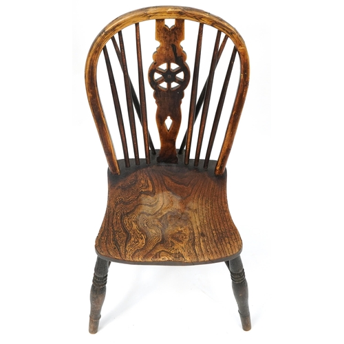 1032 - Antique ash and elm wheelback chair impressed J M to the back, 90cm high