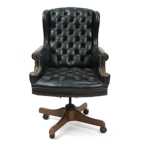 1061 - Mahogany framed captain's chair with black leather button upholstery, 109cm high