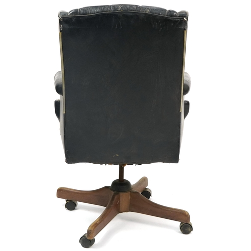 1061 - Mahogany framed captain's chair with black leather button upholstery, 109cm high