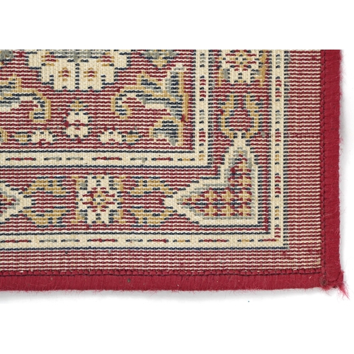 1080 - Rectangular Persian rug, the central field having a repeat tree design, the red ground borders havin... 