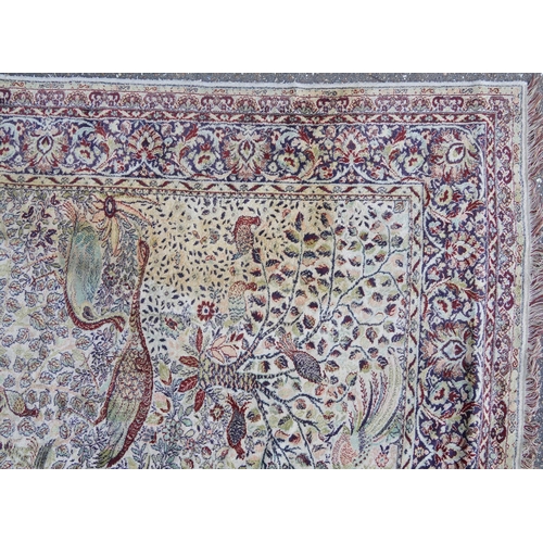 1084 - Rectangular Persian carpet, the central field decorated with birds of paradise amongst flowers withi... 