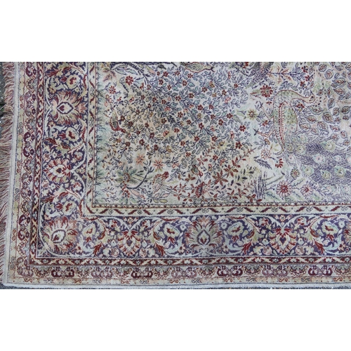 1084 - Rectangular Persian carpet, the central field decorated with birds of paradise amongst flowers withi... 