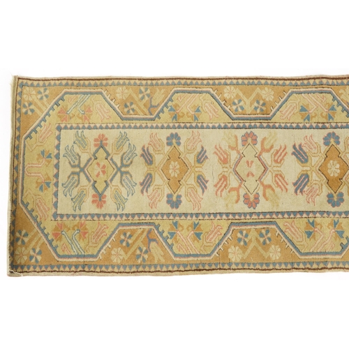 1086 - Rectangular Turkish rug having an allover floral design, 195cm x 80cm