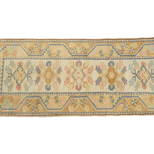 1086 - Rectangular Turkish rug having an allover floral design, 195cm x 80cm