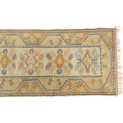 1086 - Rectangular Turkish rug having an allover floral design, 195cm x 80cm