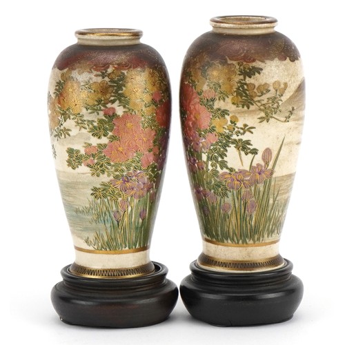 97 - Pair of Japanese Satsuma pottery vases raised on hardwood stands, each hand painted with wisteria, Y... 