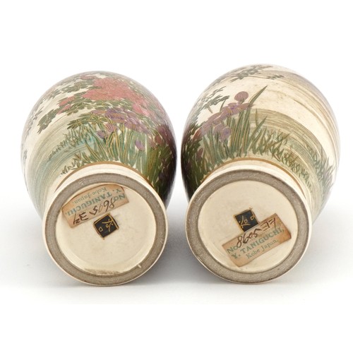 97 - Pair of Japanese Satsuma pottery vases raised on hardwood stands, each hand painted with wisteria, Y... 