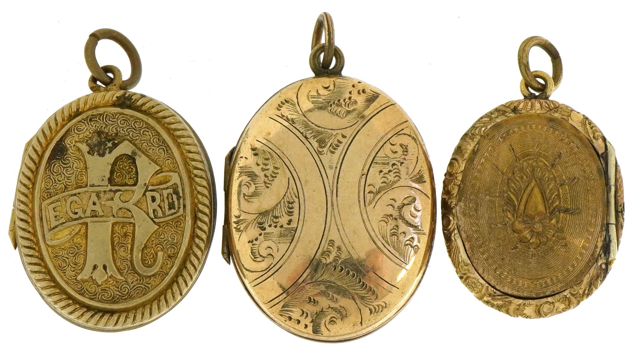 Three Victorian and later oval lockets comprising a yellow metal ...