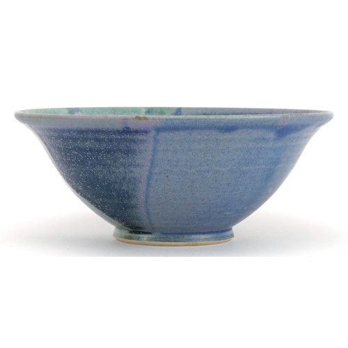 382 - Studio pottery bowl having a blue dripping glaze, impressed marks to the base, 14cm in diameter