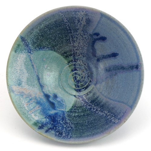 382 - Studio pottery bowl having a blue dripping glaze, impressed marks to the base, 14cm in diameter