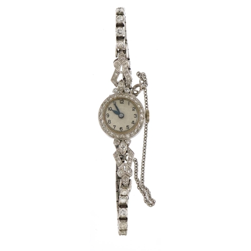 2048 - Art Deco ladies platinum and diamond cocktail watch, the 14ct white gold strap set with twenty eight... 