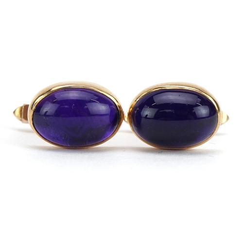 2088 - Pair of 9ct gold cabochon purple stone cufflinks housed in a Harrods box, each 1.6cm wide, 7.4g