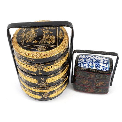 188 - Two Chinese painted three section lacquered wood food carriers comprising one inset with porcelain p... 