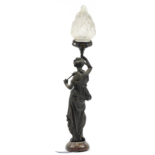 197 - Bronzed design table lamp in the form of an Art Nouveau female with frosted flame glass shade, 69cm ... 