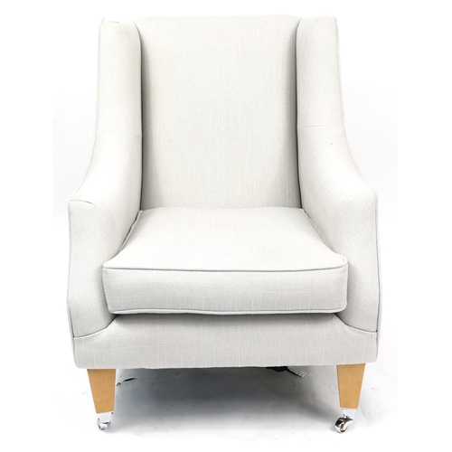 1065A - Contemporary wingback style armchair with light wood feet and chrome casters