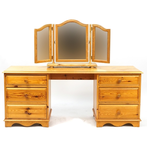 1081A - Pine bedroom furniture comprising dressing table with triple aspect mirror, six drawer chest, two tw... 