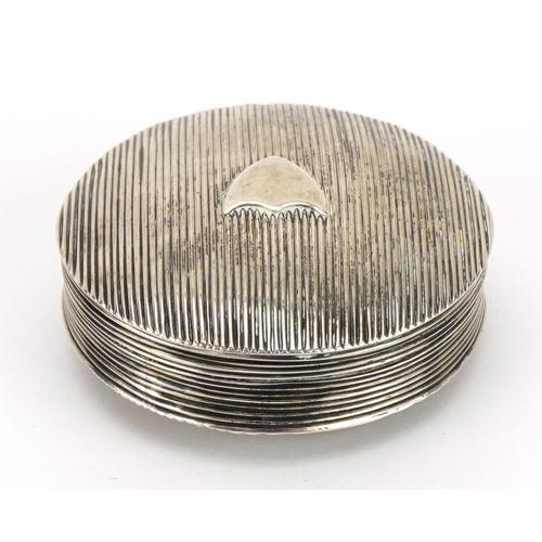 96 - Circular Dutch silver pill box with engine turned decoration, impressed marks to the interior, 5cm i... 