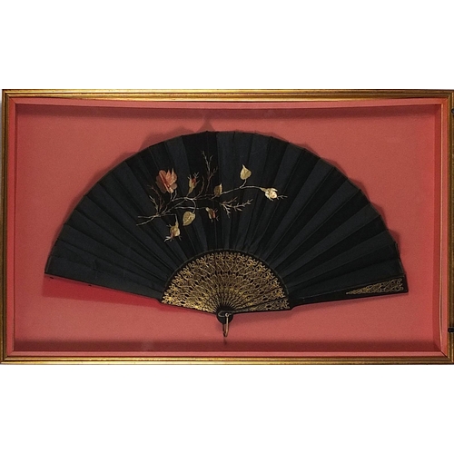 270 - Three Victorian fans comprising two mourning examples and one with bone sticks, each housed in a gla... 