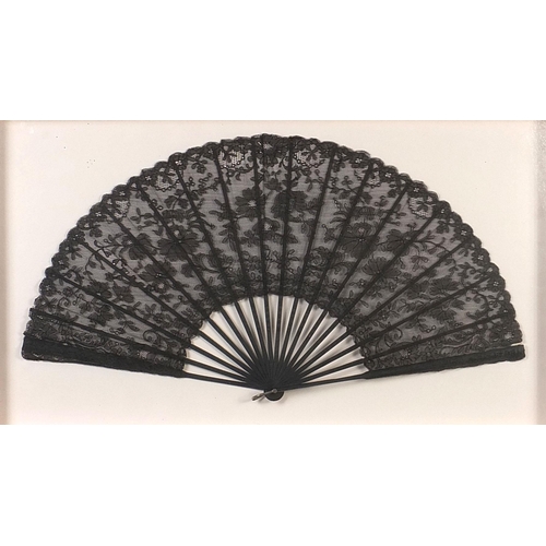 270 - Three Victorian fans comprising two mourning examples and one with bone sticks, each housed in a gla... 
