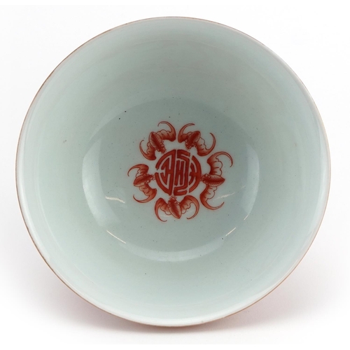 360 - Chinese iron red porcelain bowl hand painted with flower heads amongst scrolling foliage, six figure... 