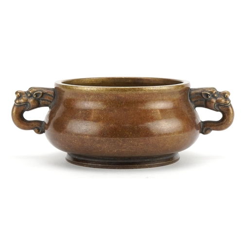 126 - Chinese patinated bronze censer with animalia twin handles, four figure character marks to the base,... 