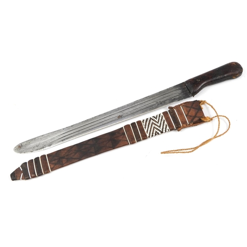 2200 - Asian hunting knife with steel blade and leather sheath, 61cm in length