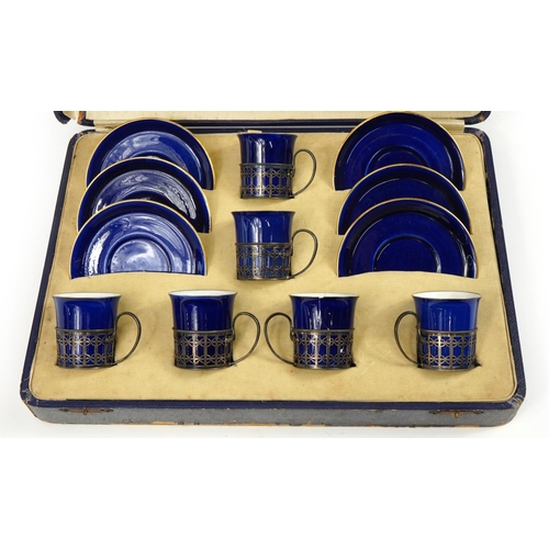 59 - Set of six Shelley blue ground coffee cans and saucers with silver cup holders housed in a fitted si... 