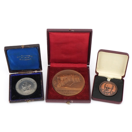 2459 - Three medallions with fitted cases including Winston Churchill and Royal Jubilee Exhibition Manchest... 