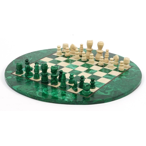 2002 - Circular malachite and onyx chess set with chess pieces, the largest chess pieces each 6cm high, the... 
