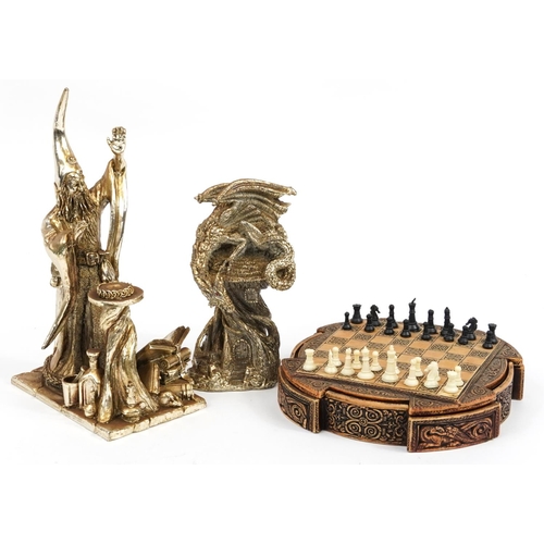 1229 - Celtic design chess board with pieces and two silvered Myth & Magic style figures, the largest 28cm ... 