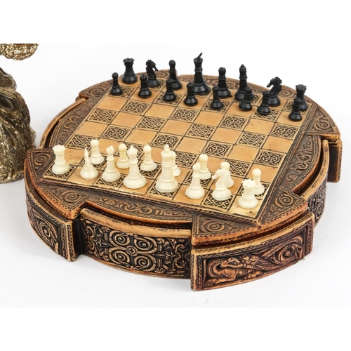 1229 - Celtic design chess board with pieces and two silvered Myth & Magic style figures, the largest 28cm ... 