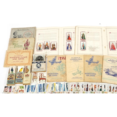 2250 - Collection of cigarette cards and silk tea cards, some arranged in albums, including Will's Cigarett... 