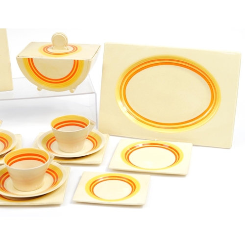 153 - Clarice Cliff, Art Deco Biarritz dinnerware including meat plates, lidded tureen and trios, the larg... 