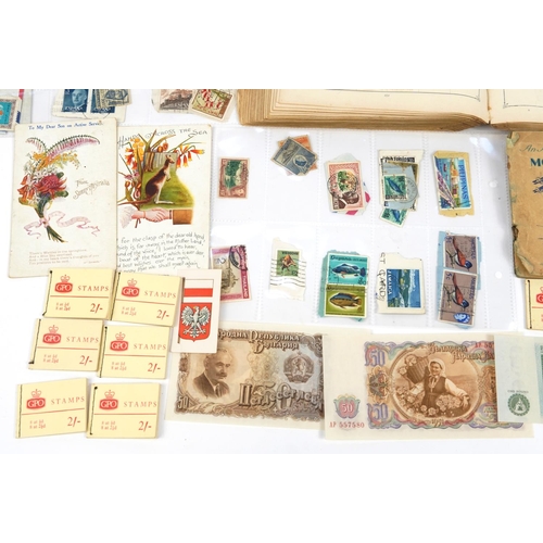 2532 - 19th century and later ephemera including world stamps arranged in an album and cigarette cards