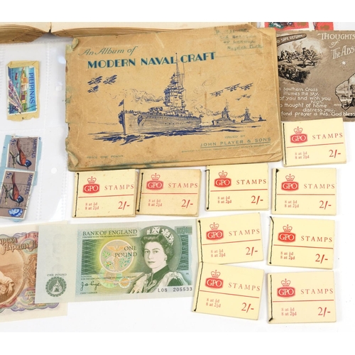 2532 - 19th century and later ephemera including world stamps arranged in an album and cigarette cards